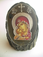 Icon St. Mary on wood stump
