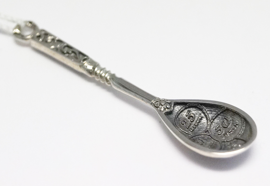 Sivler spoon for scooping money